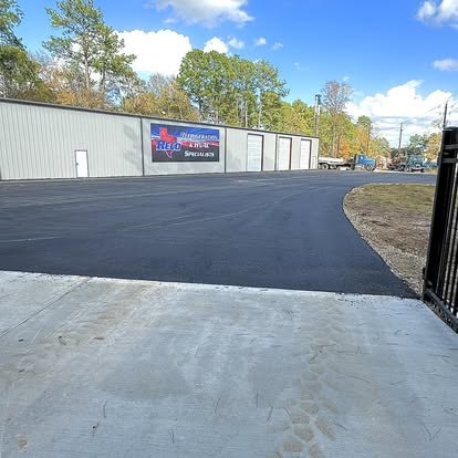 Commercial entrance and yard paved for truck traffic.