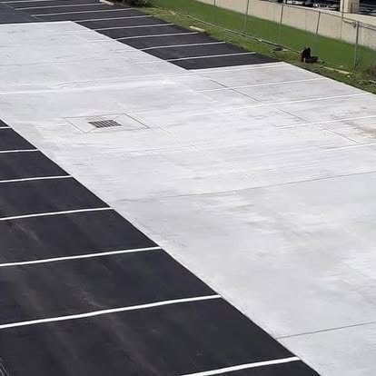 Fresh stall striping over new pavement.