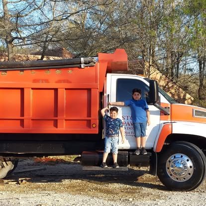 The Stokes Paving truck — and the next generation of the crew.